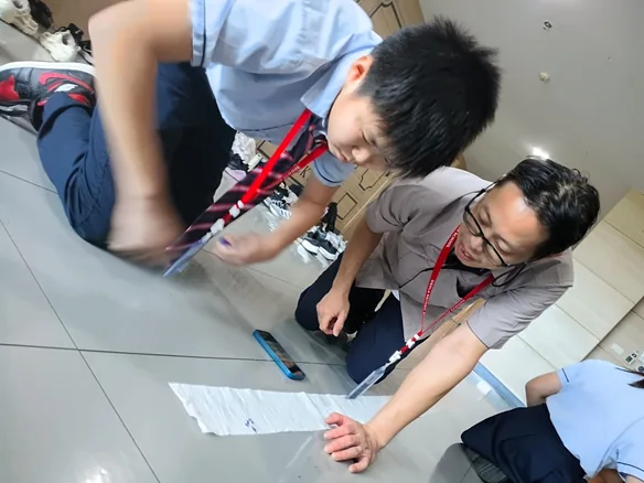 Students and an educator taking part in a hands-on astronomy activity.