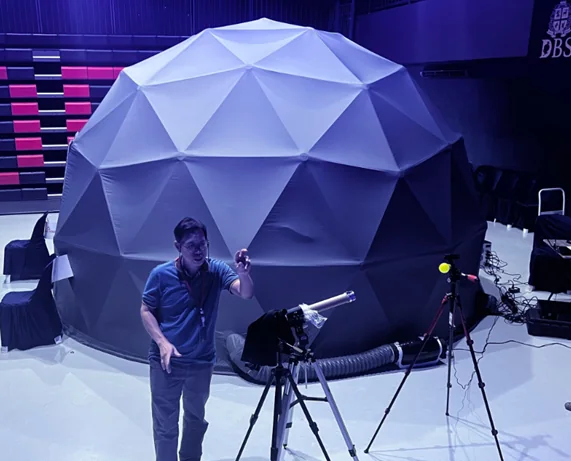 Inflatable mobile planetarium dome prepared for a school programme.